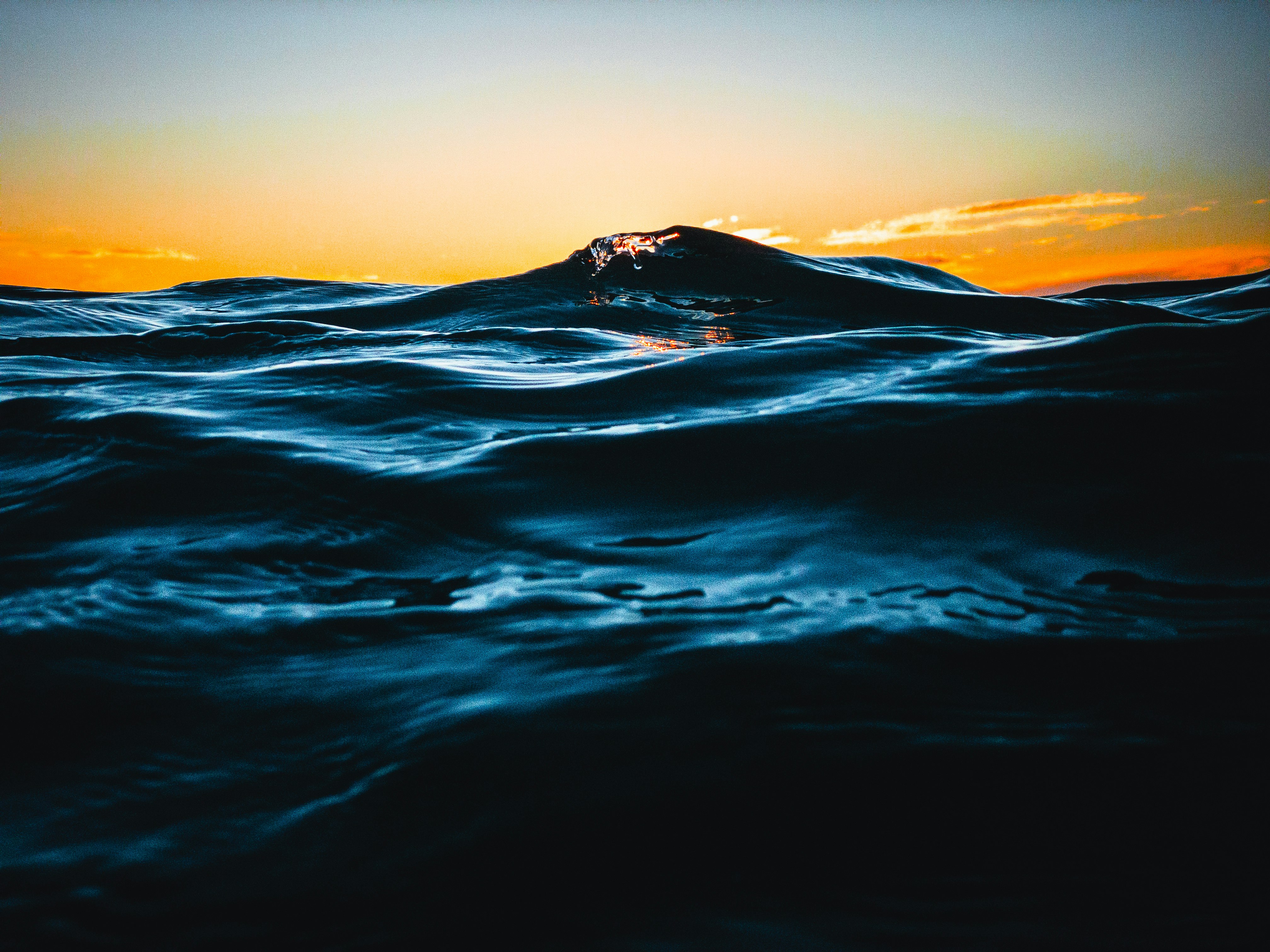 body of water during sunset